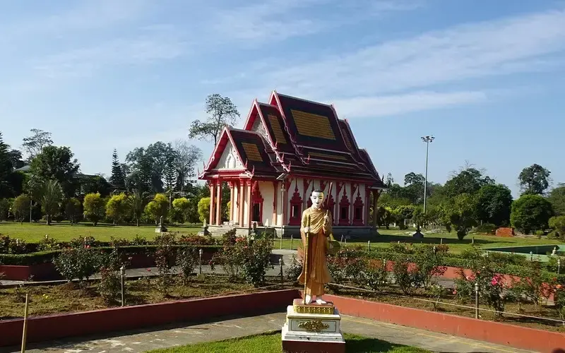 Snow-capped mountains, green valleys, and monasteries of Arunachal Pradesh under clear skies.